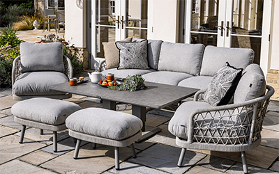 Hartman Aries 3 seat lounge set. Positioned on a stone patio, with a house with French doors in the background