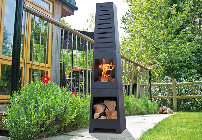 Image of La Hacienda Skyline Black Steel Garden Chiminea With Laser Cut Design